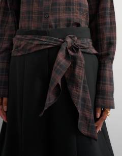 Model wearing Co ord contrast check wrap barrel trouser in black