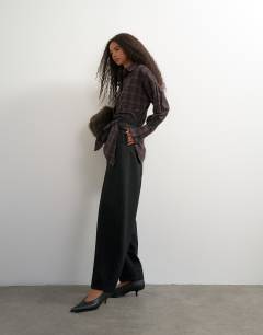 Model wearing Co ord contrast check wrap barrel trouser in black
