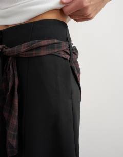 Model wearing Co ord contrast check wrap barrel trouser in brown