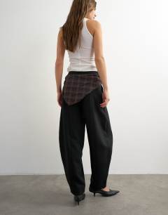 Model wearing Co ord contrast check wrap barrel trouser in brown