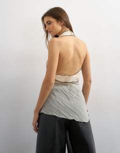 Model wearing Co-ord crinkle halter top with contrast trim in ecru