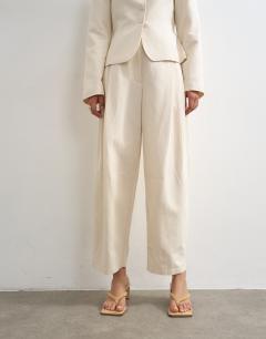 Model wearing Co ord crop barrel trouser in ecru