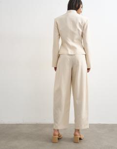 Model wearing Co ord crop barrel trouser in ecru