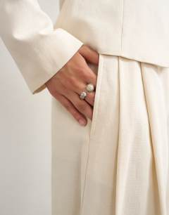 Model wearing Co ord crop barrel trouser in ecru
