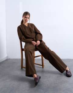 Model wearing Co ord double pleated slouchy trouser in chocolate