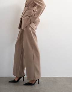 Model wearing Co ord double tailored trouser in beige 