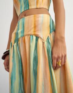 Model wearing Co-ord drop waist full circle midi skirt in orange abstract stripe