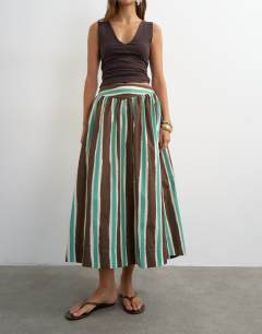 Model wearing Co-ord drop waist saloon maxi skirt in brown stripe