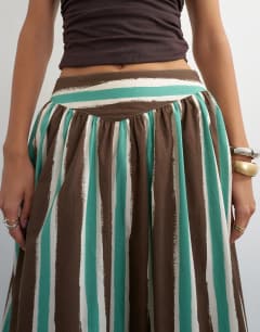 Model wearing Co-ord drop waist saloon maxi skirt in brown stripe