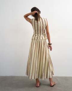 Model wearing Co-ord dropped waist deep v maxi skirt in buttermilk stripe