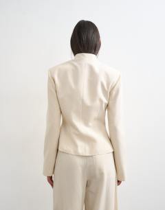 Model wearing Co ord drummer jacket in ecru