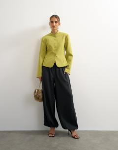 Model wearing Co ord drummer jacket in olive