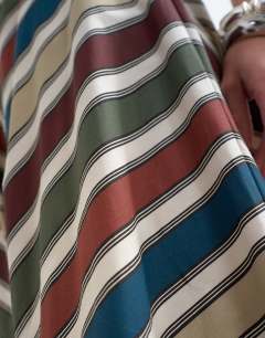 Model wearing Co-ord elasticated waist full circle maxi skirt in multi stripe