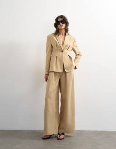 Model wearing Co ord extreme cinched waist blazer in beige