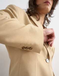 Model wearing Co ord extreme cinched waist blazer in beige