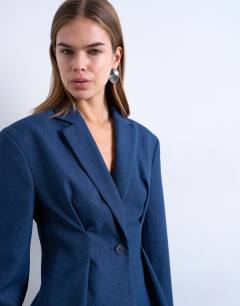 Model wearing Co ord extreme cinched waist blazer in navy