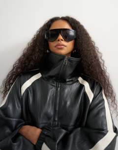 Model wearing Co-ord faux leather colour block jacket in black
