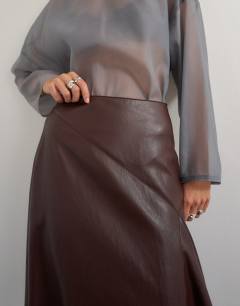 Model wearing Co-ord faux leather drape detail maxi skirt in chocolate