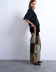 Model wearing Co ord  faux suede patchwork cinch trousers in multi