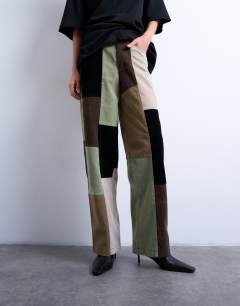 Model wearing Co ord  faux suede patchwork cinch trousers in multi