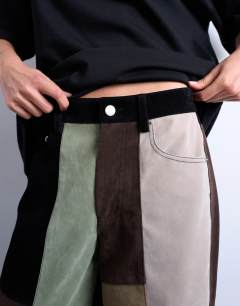 Model wearing Co ord  faux suede patchwork cinch trousers in multi