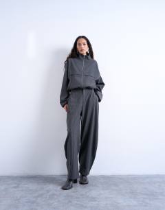 Model wearing Co ord funnel neck jacket in charcoal stripe