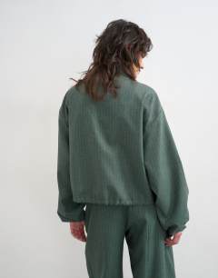 Model wearing Co ord funnel neck jacket in green stripe