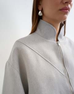 Model wearing Co ord funnel neck jacket in grey 