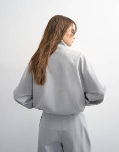 Model wearing Co ord funnel neck jacket in light grey