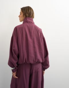 Model wearing Co ord funnel neck track jacket in fig
