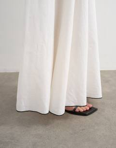 Model wearing Co-ord heavy linen rich maxi skirt with black contrast piping in white