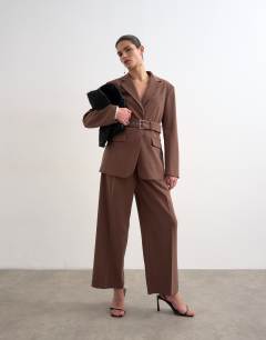 Model wearing Co ord high break belted blazer in chocolate