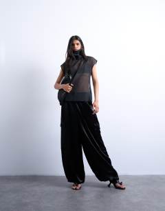 Model wearing Co-ord high neck grown on shoulder sheer organza top in black