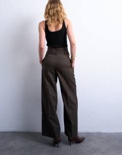 Model wearing Co ord high waisted belted trouser in brown