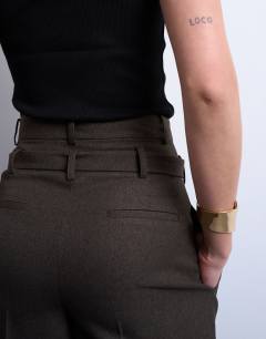 Model wearing Co ord high waisted belted trouser in brown