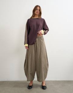 Model wearing Co-ord horseshoe trouser in check