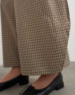 Model wearing Co-ord horseshoe trouser in check
