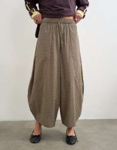 Model wearing Co-ord horseshoe trouser in check