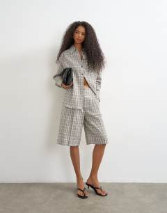 Model wearing Co ord longline bermuda short in mono check