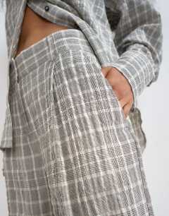 Model wearing Co ord longline bermuda short in mono check