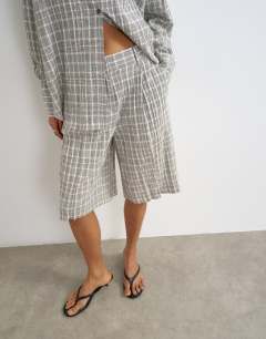 Model wearing Co ord longline bermuda short in mono check