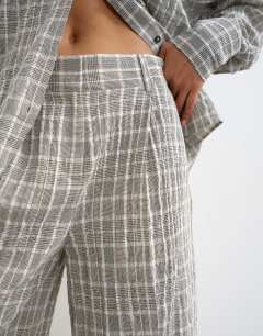 Model wearing Co ord longline bermuda short in mono check