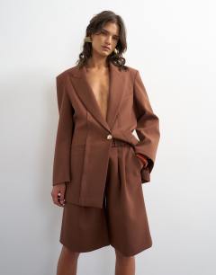 Model wearing Co ord longline short in brown