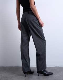 Model wearing Co ord mensy pinstripe trouser in charcoal