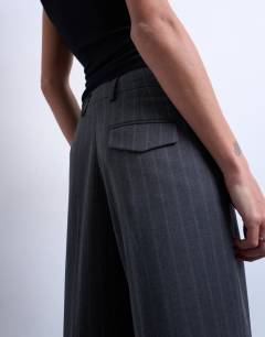 Model wearing Co ord mensy pinstripe trouser in charcoal