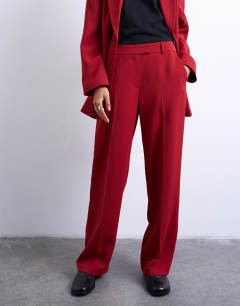 Model wearing Co ord mid rise clean straight trouser in cherry red