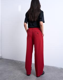 Model wearing Co ord mid rise clean straight trouser in cherry red