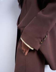 Model wearing Co ord mid rise clean straight trouser in chocolate