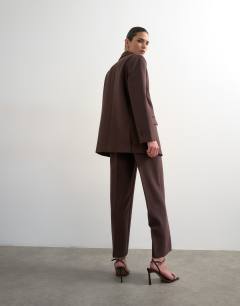 Model wearing Co ord mid rise clean straight trouser in chocolate