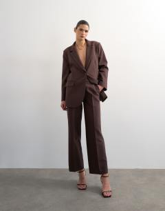 Model wearing Co ord mid rise clean straight trouser in chocolate